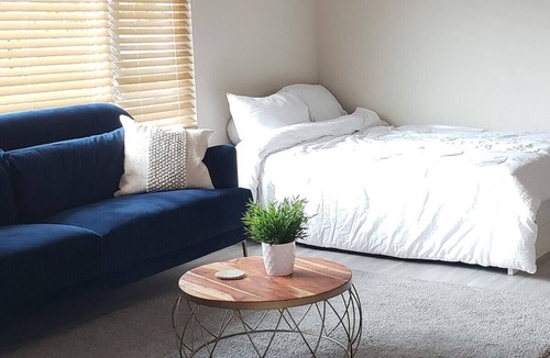 Lomita House | Front Room · Bright and Private Modern Room with City View!