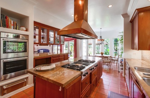 Muirlands Villa | Mediterranean magic in a sun-kissed tropical oasis with pool and pizza oven.